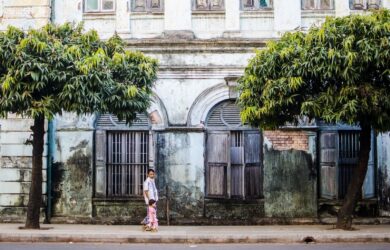 Father and daughter walking in downtown Yangon