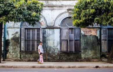 Father and daughter walking in downtown Yangon