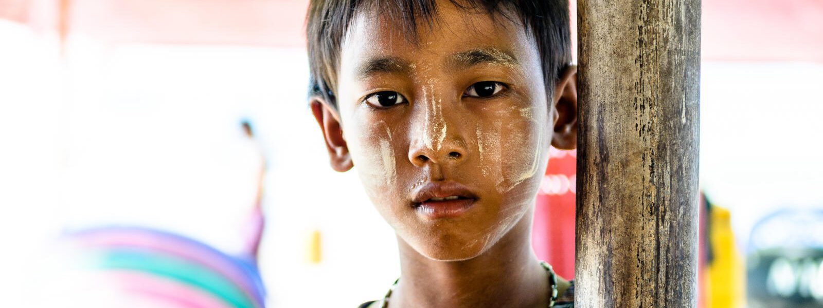 Young Myanmar boy with thanakha on his cheeks