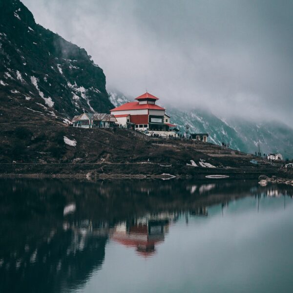 House and clouds and Tsongmo Lake on a Himalayas trek, Gangtok, Sikkim, India