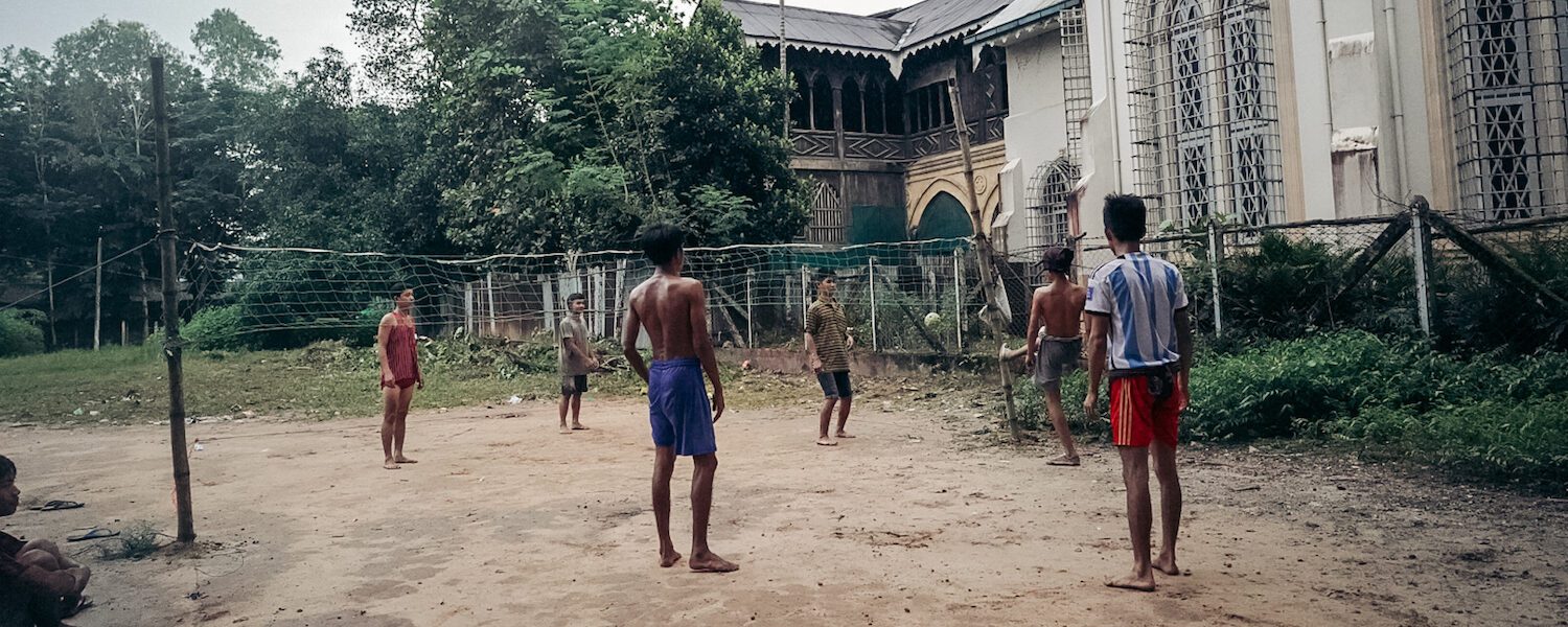 Men and boys playing games outside in Yangon