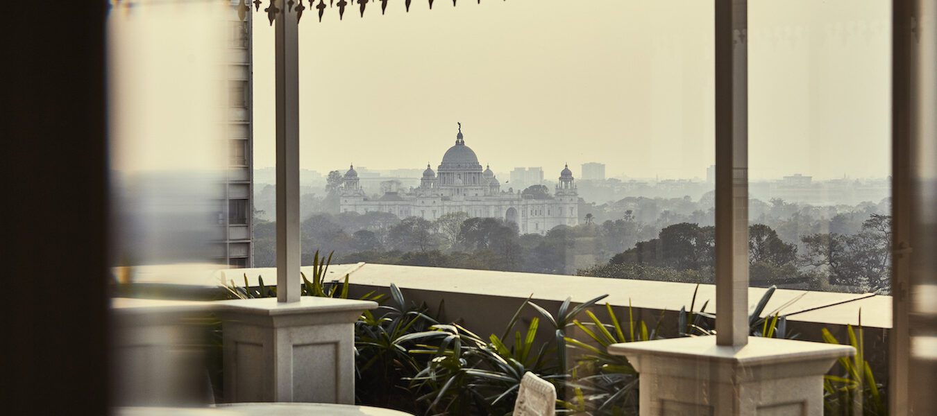 Victoria Memorial in Kolkata and terrace of the Glenburn Penthouse through the glass